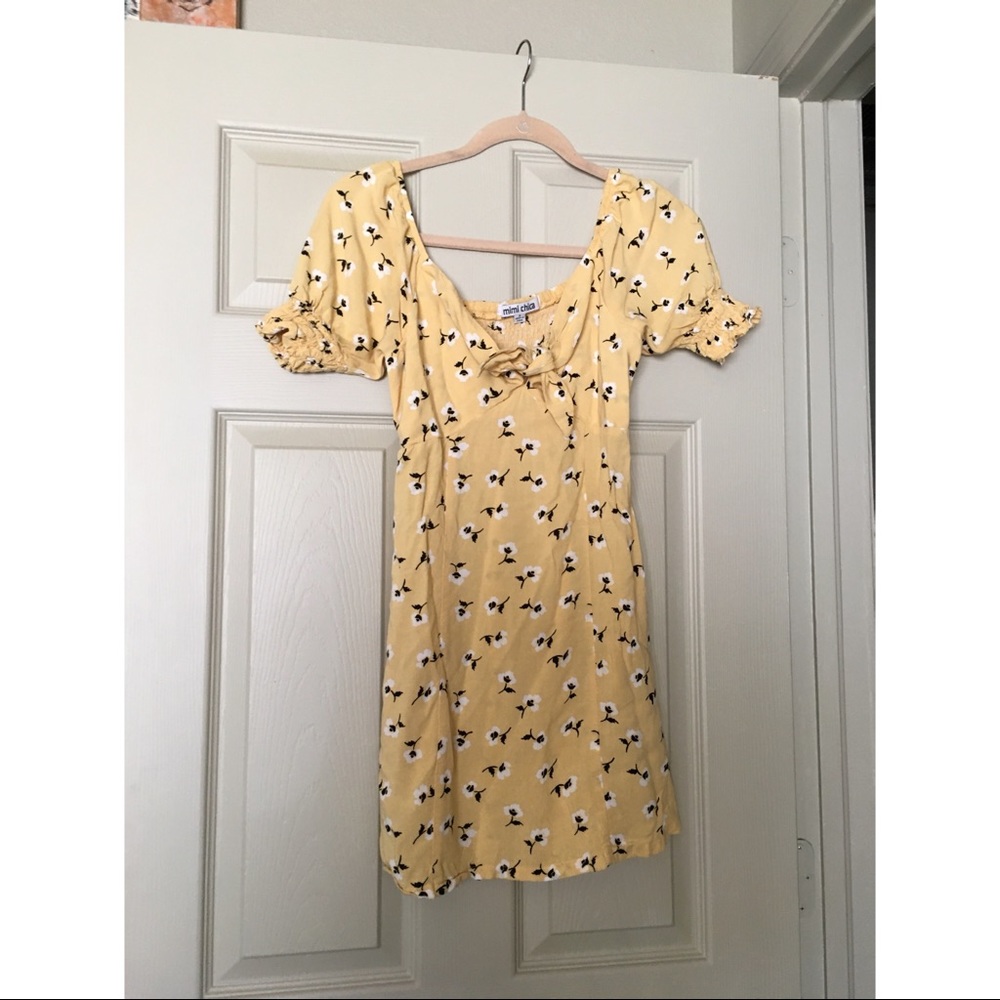 Pale yellow floral dress with ruched sleeves